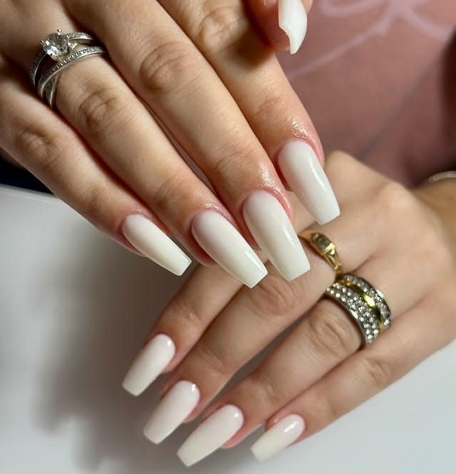 4. Modern White Coffin Nails with High Shine - white nail ideas