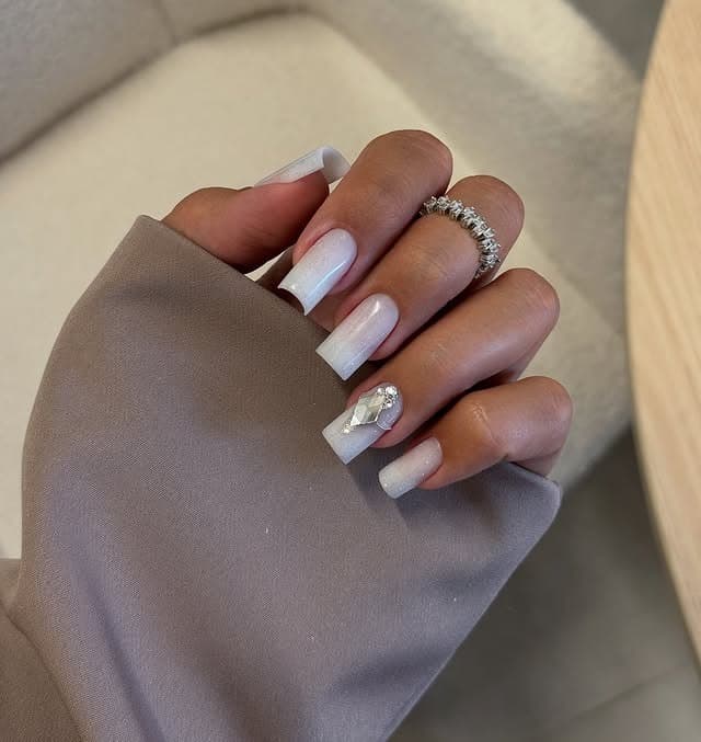 11. Milky White Coffin Nails with Rhinestone Accent - white nail ideas