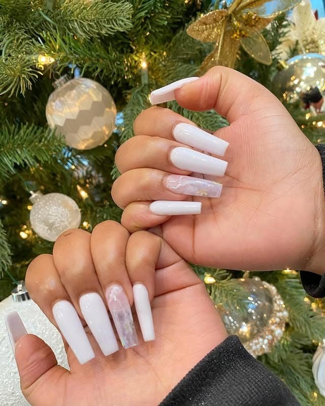 13. White Coffin Nails with Translucent Marble Accent - white nail ideas