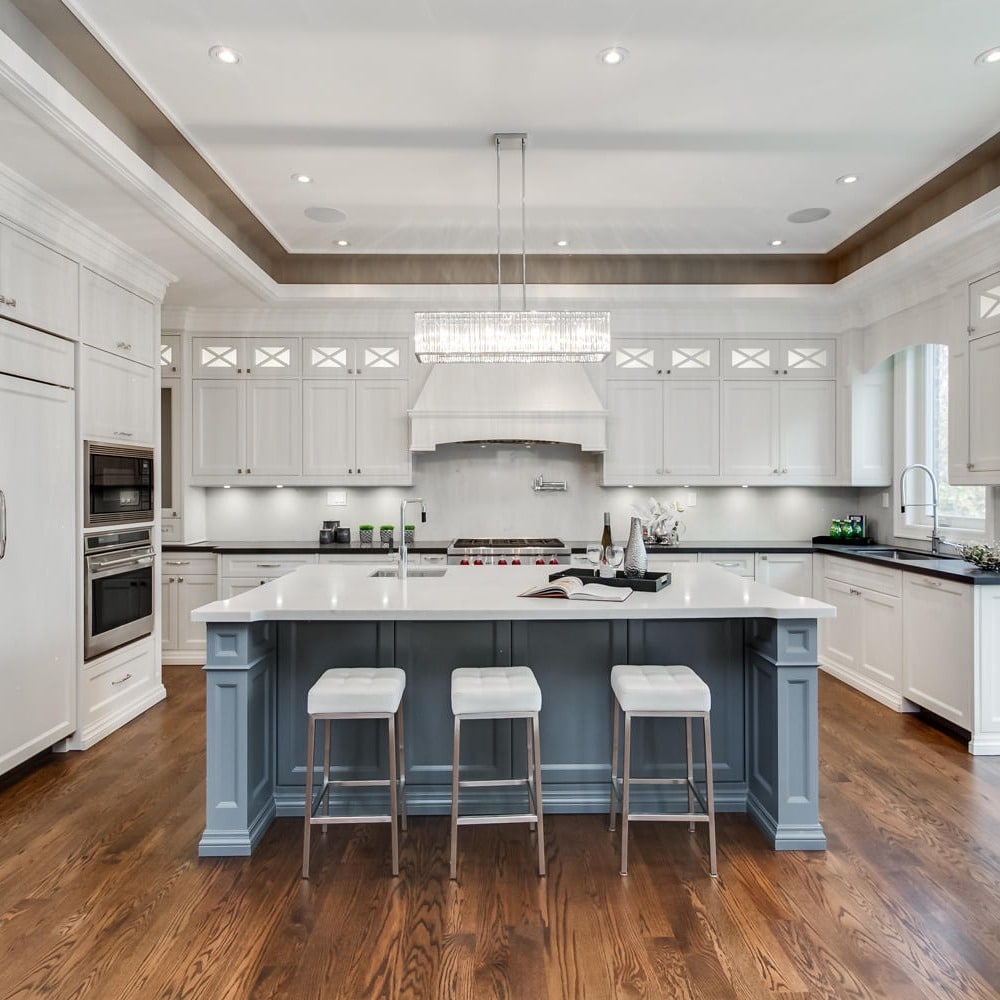 4. Transitional White Kitchen with Soft Blue Island - luxury kitchen ideas
