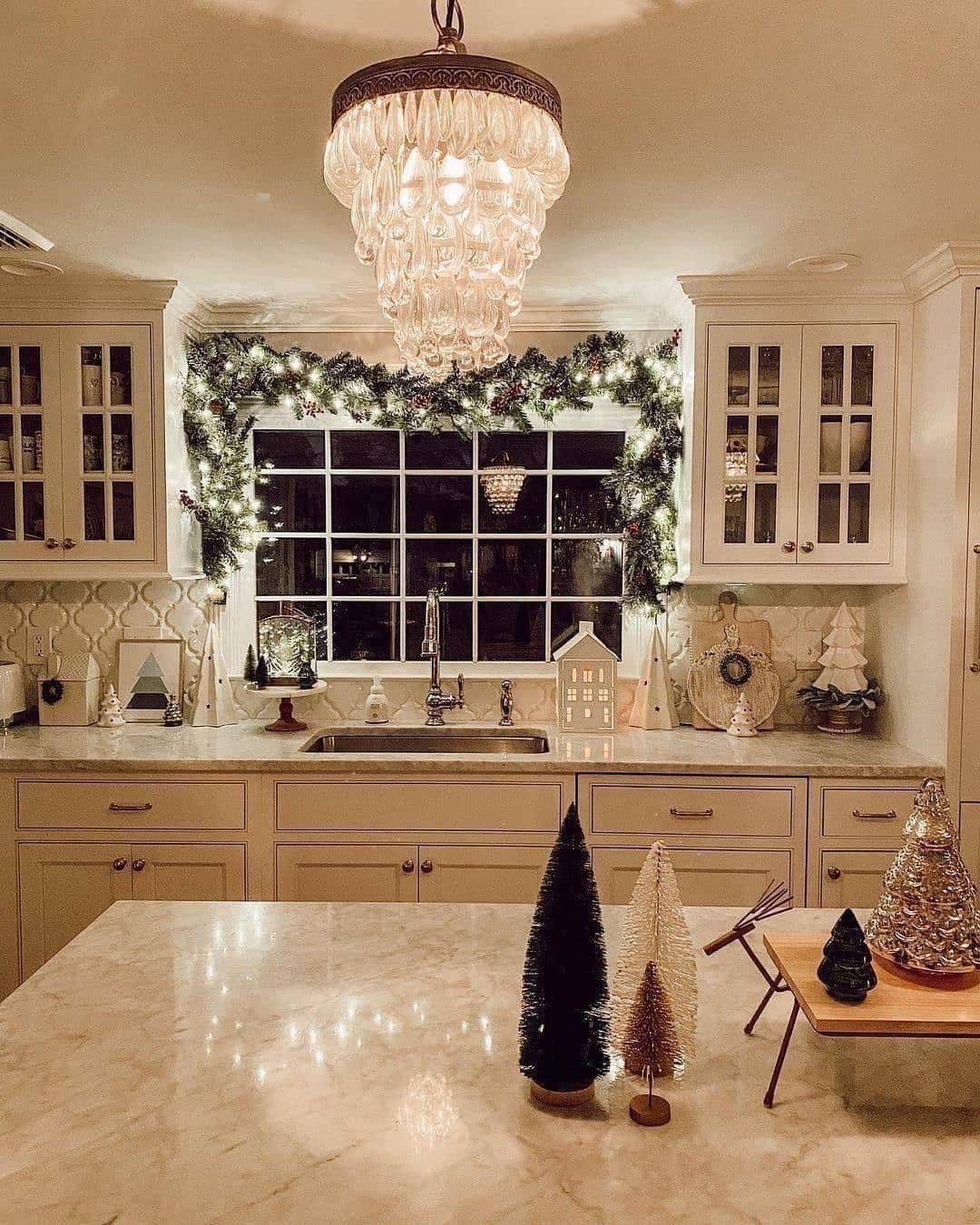 1. Elegant Neutral Christmas Kitchen with Crystal Chandelier Glow - christmas decor kitchen ideas