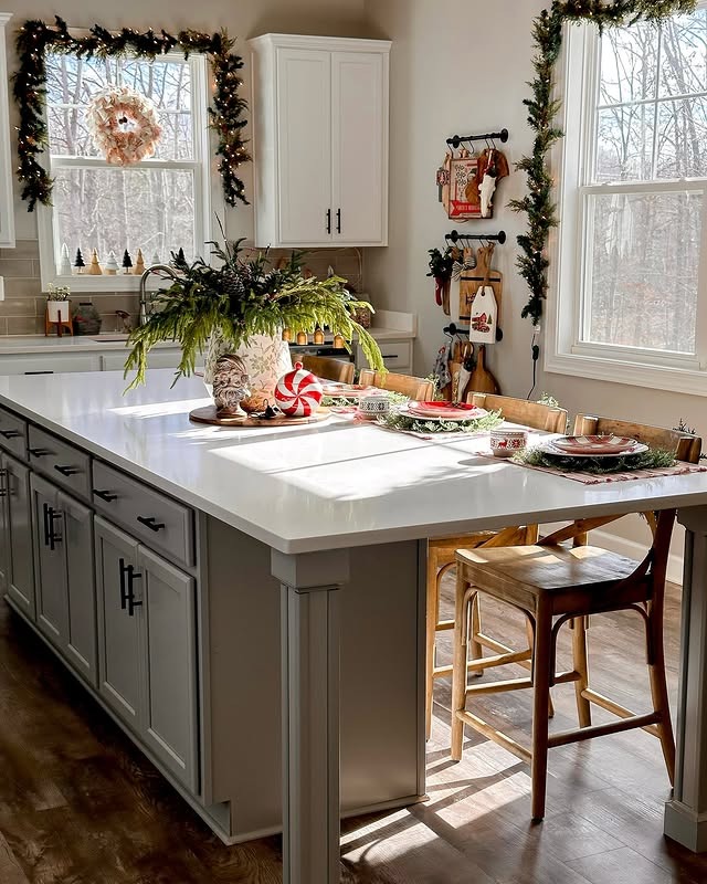 14. Bright Transitional Kitchen with Greenery and Casual Holiday Styling - christmas decor kitchen ideas