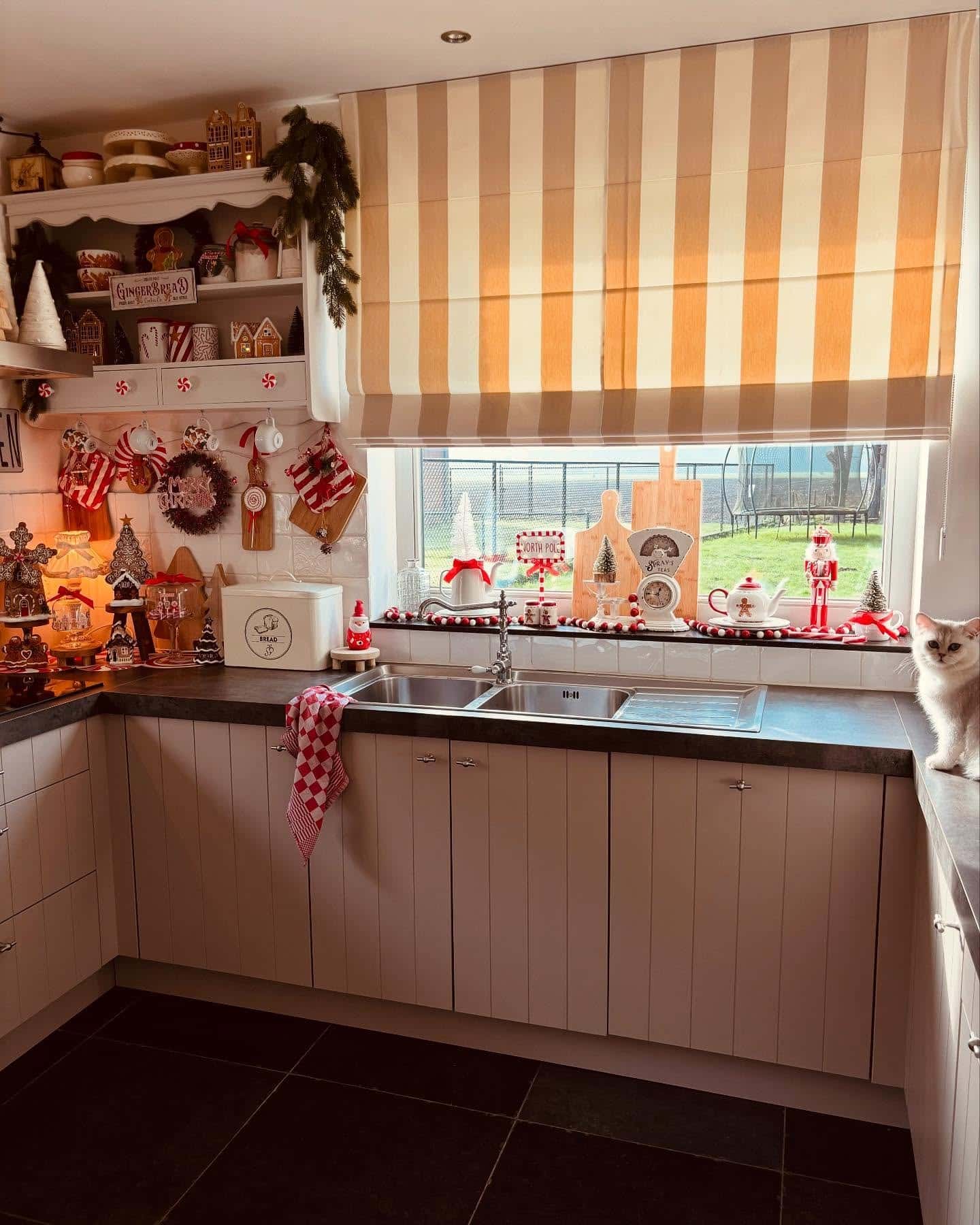 19. Playful Red and White Kitchen with Cottage Holiday Details - christmas decor kitchen ideas