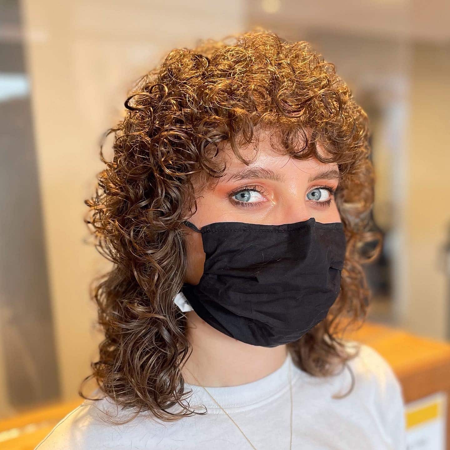 4. Defined Brunette Curly Wolf Crop - Curly Wolf Haircut