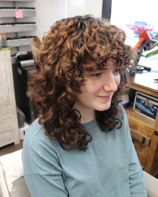 9. Defined Chocolate Curly Wolf with Face Framing - Curly Wolf Haircut