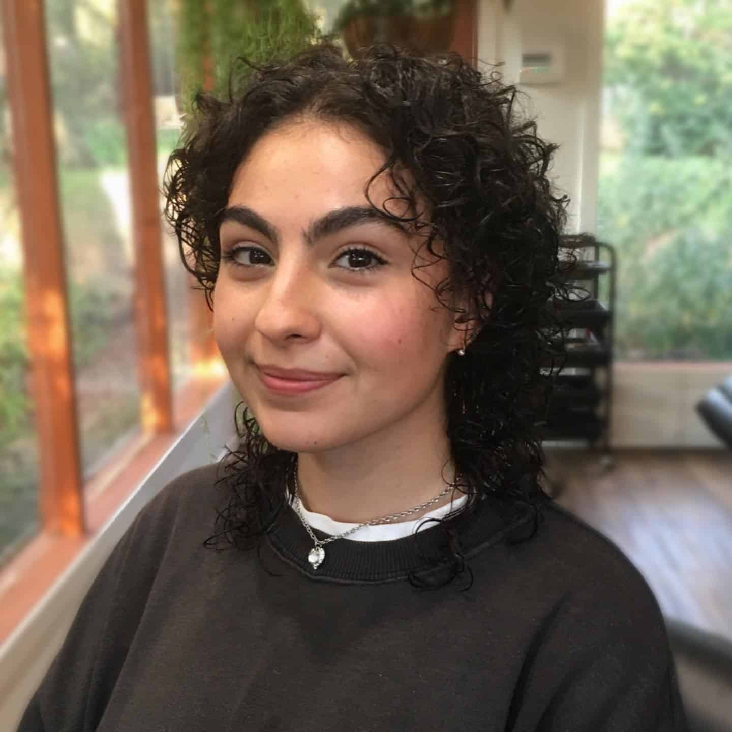 10. Short Natural Curly Wolf with Tapered Ends - Curly Wolf Haircut