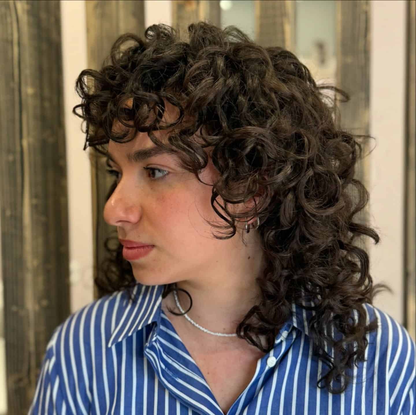 18. Short Dark Brown Curly Wolf with Rounded Fringe - Curly Wolf Haircut