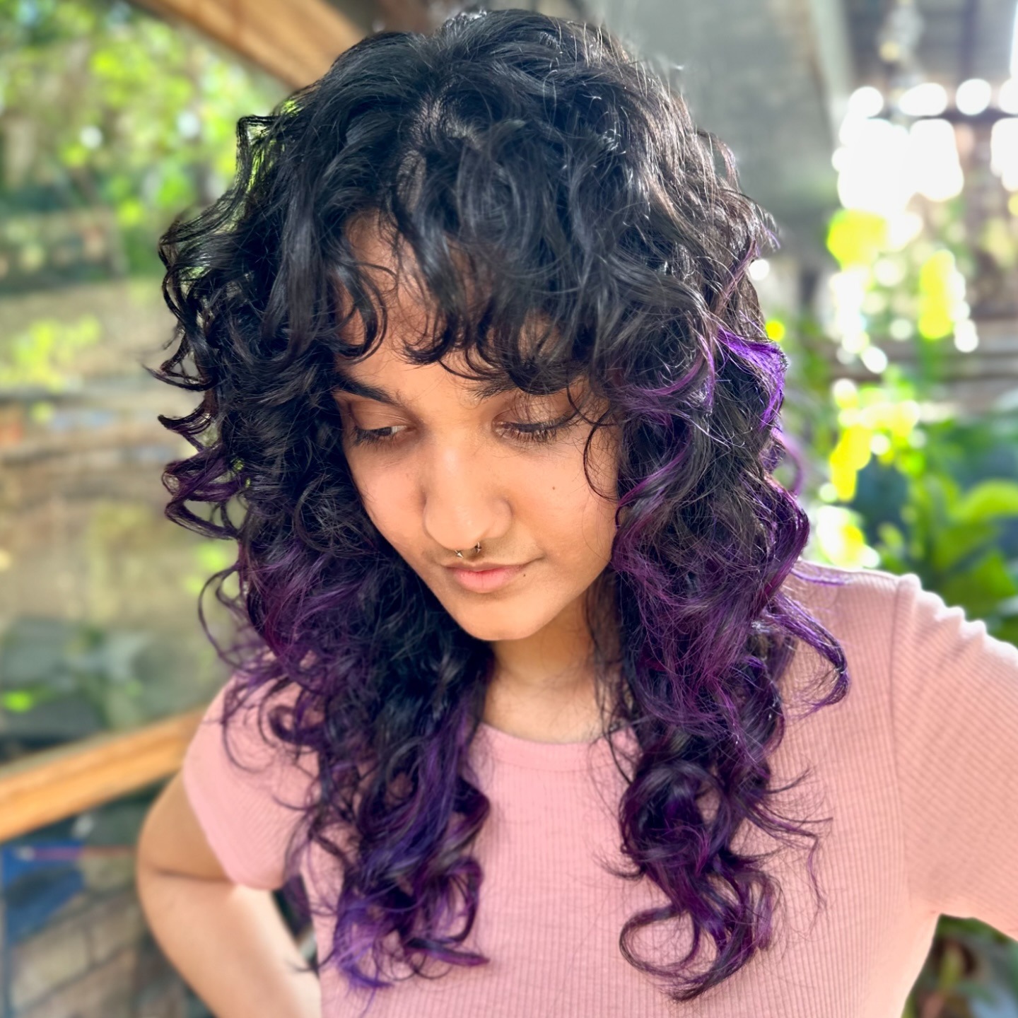 19. Black Curly Wolf Cut with Violet Accent Pieces - Curly Wolf Haircut