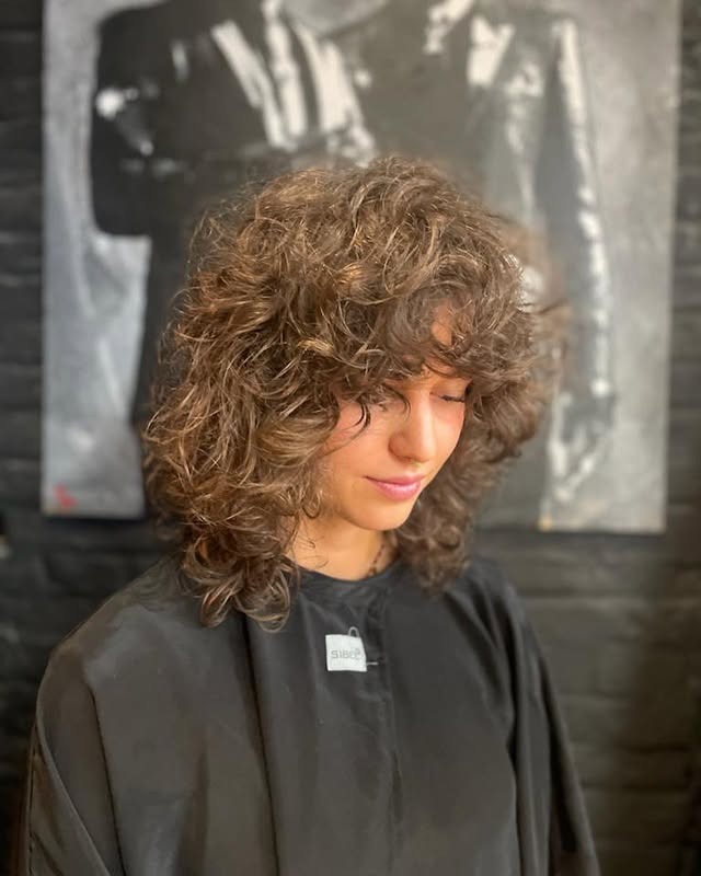 20. Layered Ash Brown Curly Wolf Shag with Soft Texture - Curly Wolf Haircut