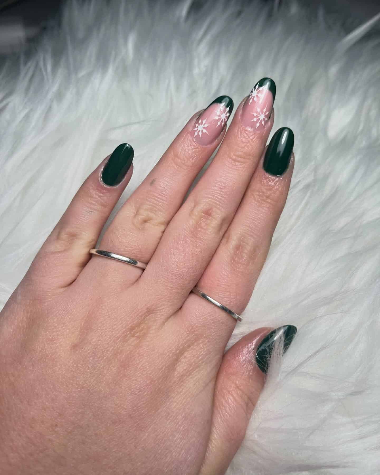 3. Forest Green Snowflake Accent Nails - green christmas nail ideas