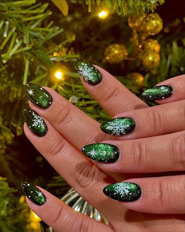 6. Glittering Green Snowflake Almond Nails - green christmas nail ideas