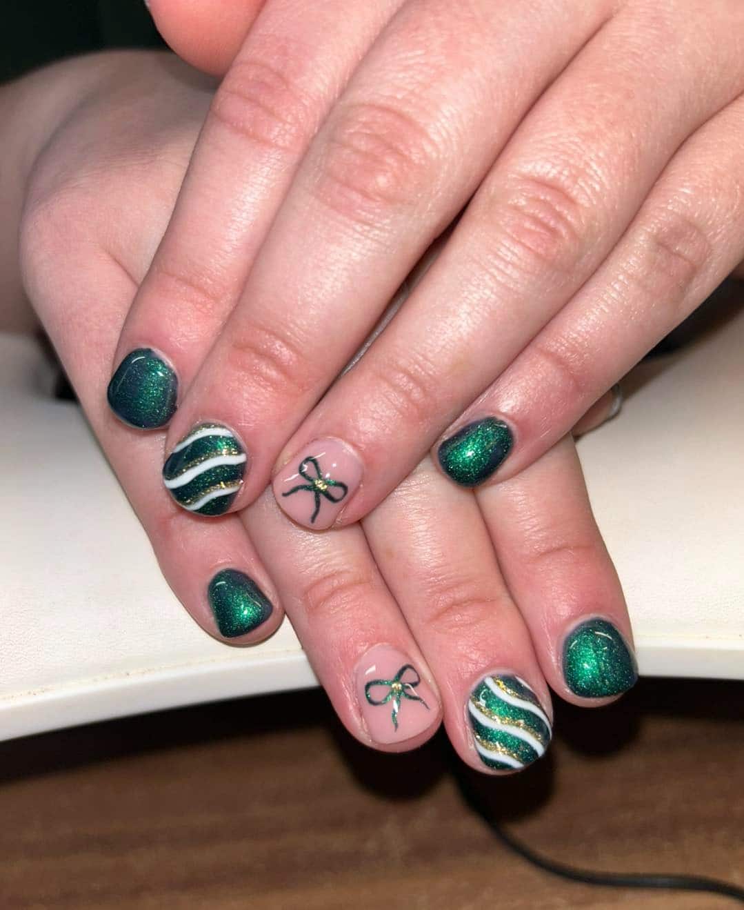 7. Green Glitter Ribbon Accent Nails - green christmas nail ideas