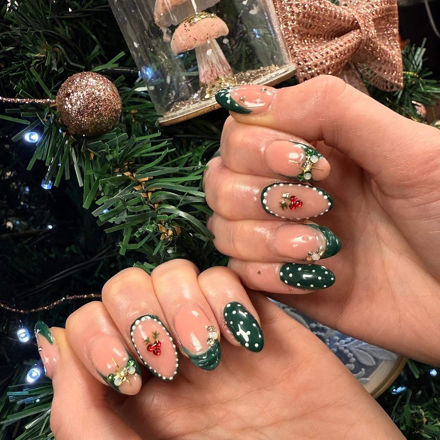 11. Festive Emerald French with Holly and Crystal Accents - green christmas nail ideas