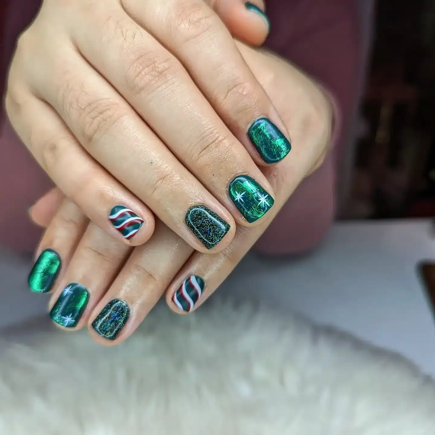 21. Short Emerald Chrome and Glitter Accent Nails with Holiday Stripes - green christmas nail ideas