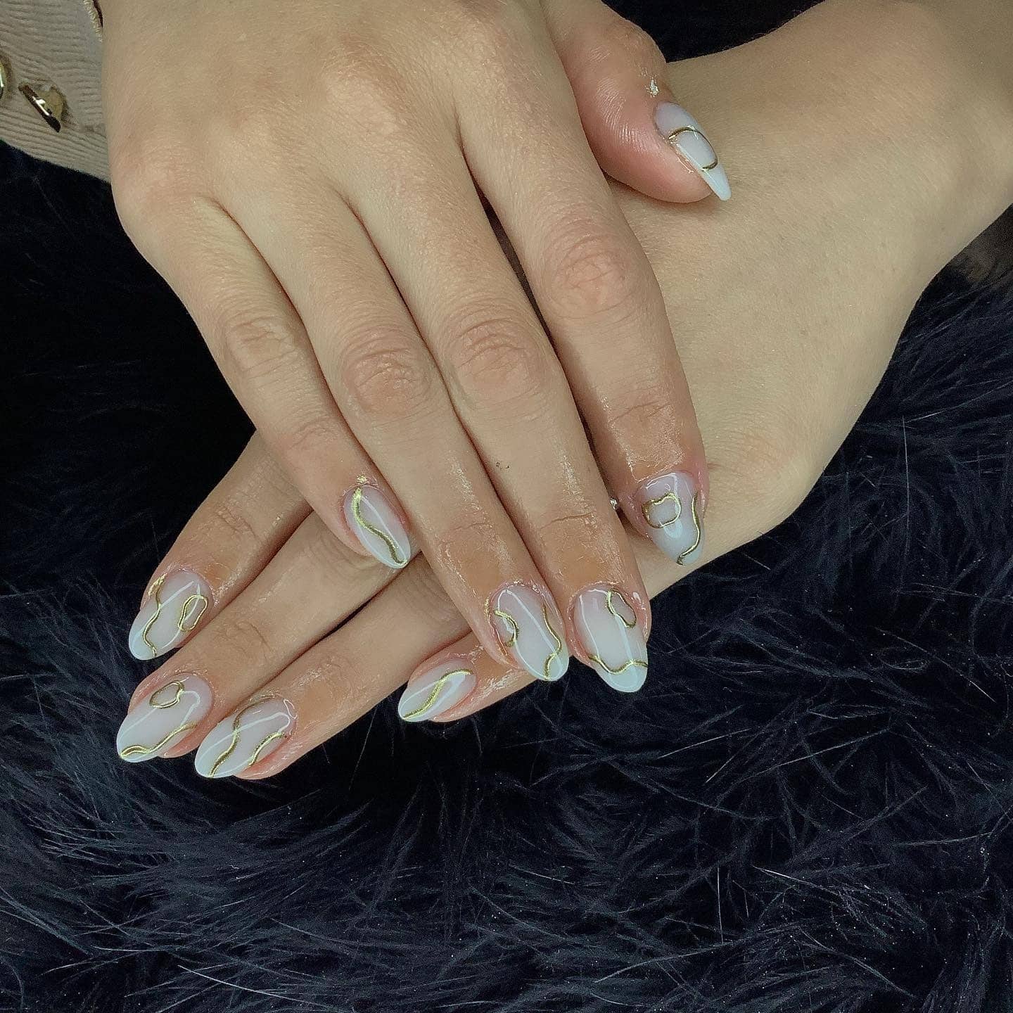 4. Milky White Almond Nails with Fine Gold Line Accents - lines nail ideas