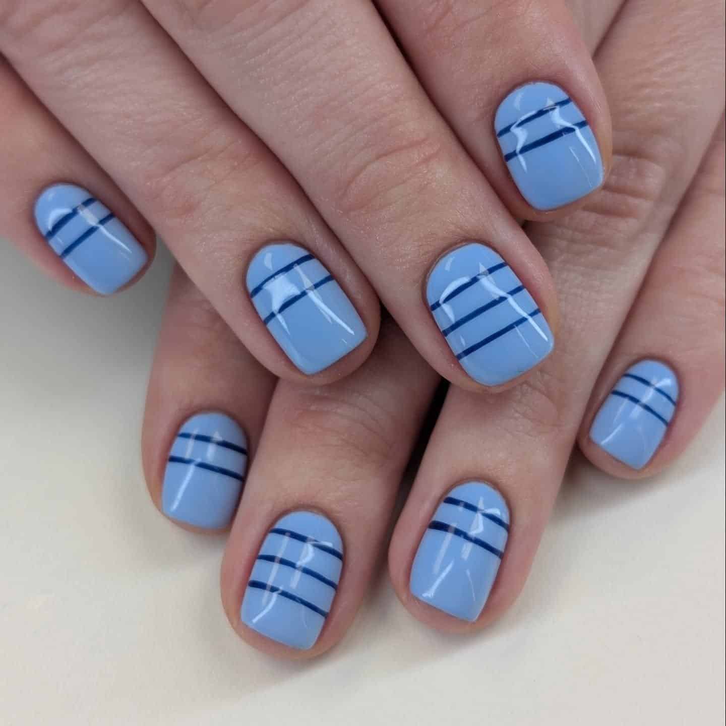 22. Almond Nude Nails with Black Swirl Line French Design - lines nail ideas