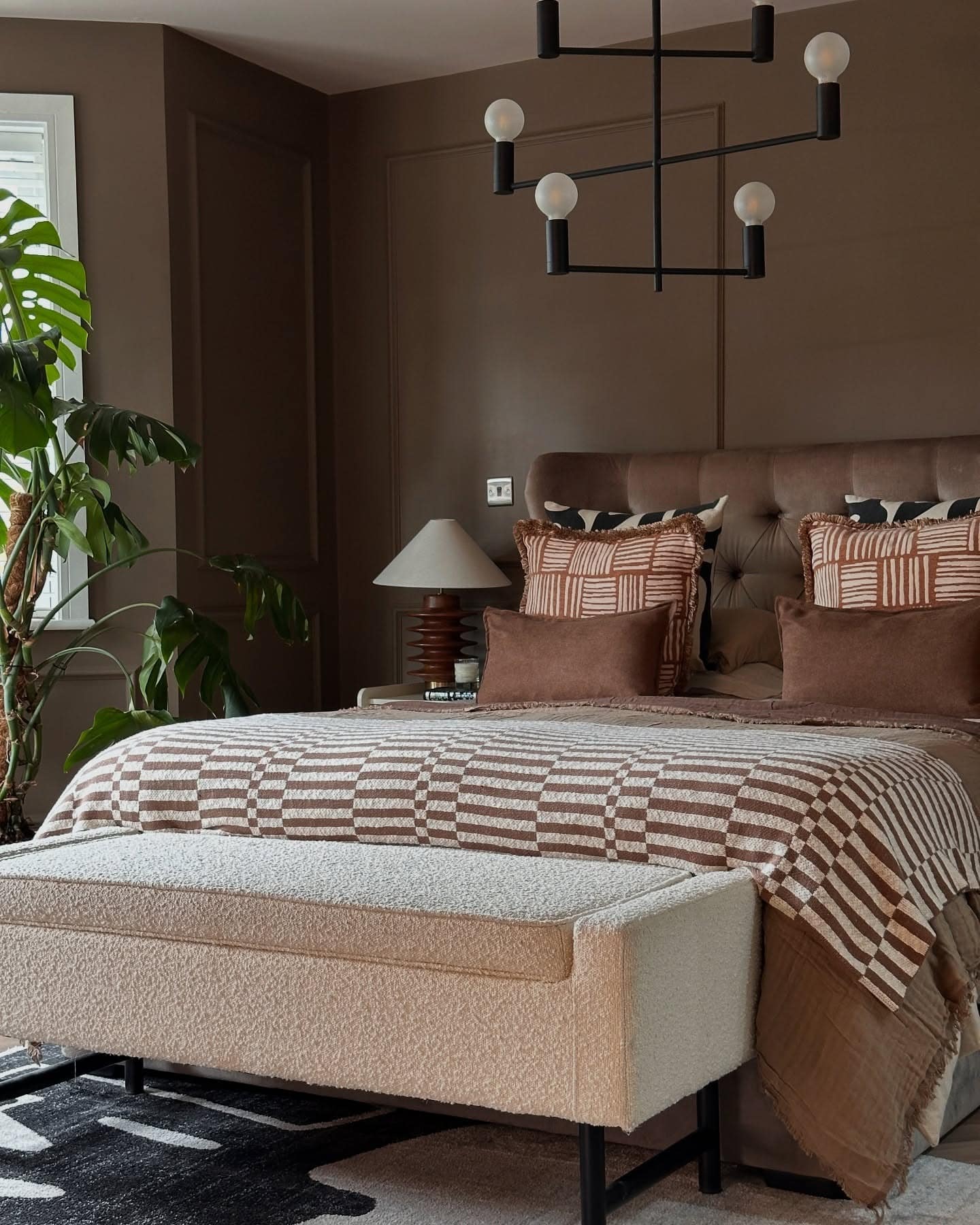 10. Deep Mocha Bedroom with Modern Lighting Fixture - brown bedroom ideas