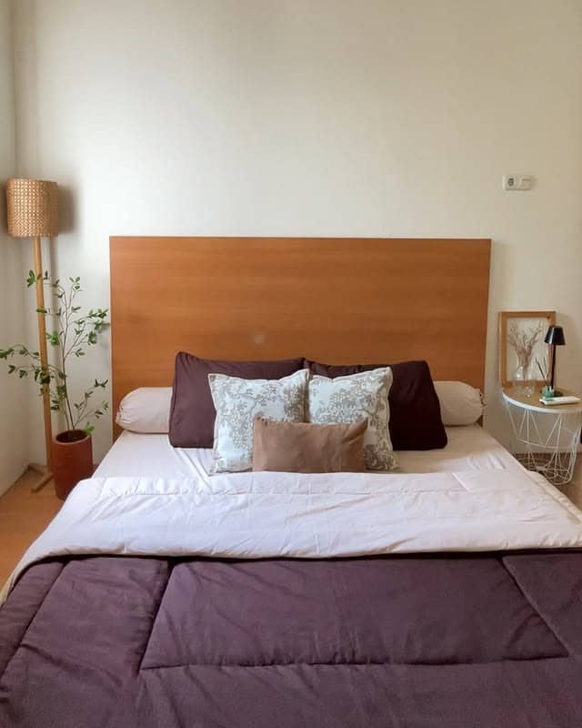 8. Simple Bedroom with Warm Wood and Soft Accents - simple bedroom ideas