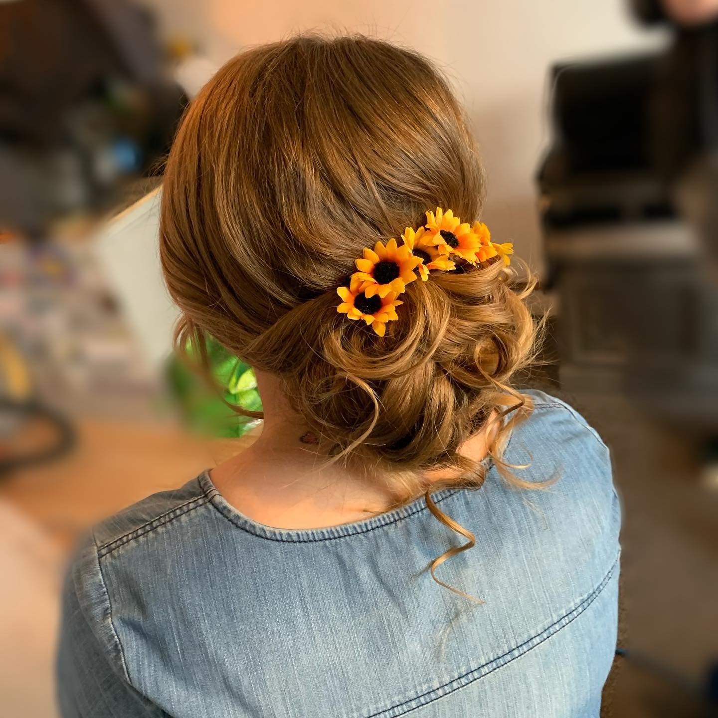 4. Romantic Low Bun with Floral Accents and Honey Blonde - Low Messy Hair Bun