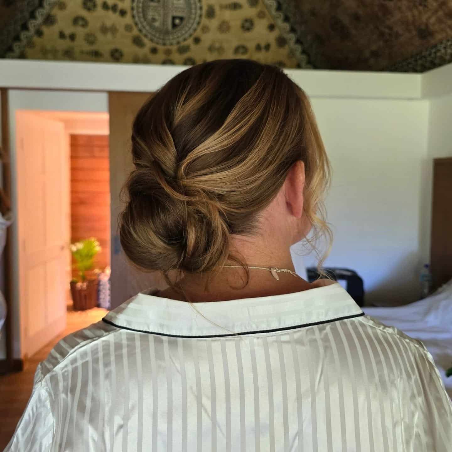 6. Elegant Folded Low Bun in Soft Brunette - Low Messy Hair Bun