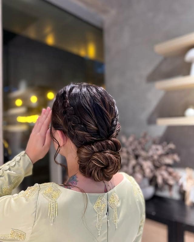 9. Loose Braided Low Bun with Soft Blonde Balayage - Low Messy Hair Bun