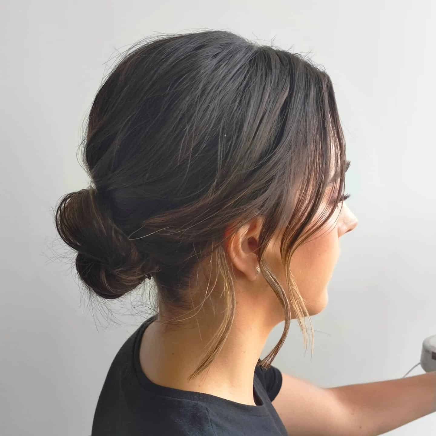15. Sleek Low Bun with Natural Dark Brown Finish - Low Messy Hair Bun