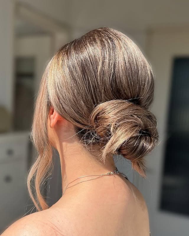 17. Minimalist Low Bun with Cool Light Brown Shine - Low Messy Hair Bun