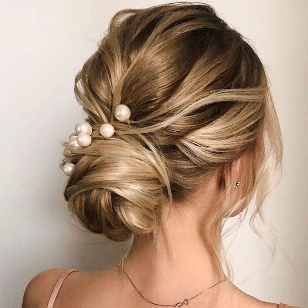 18. Low Chignon with Pearl Accents and Honey Blonde - Low Messy Hair Bun