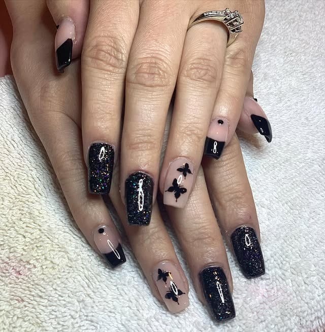 2. Black Glitter and Butterfly Accent Nails - black nail ideas