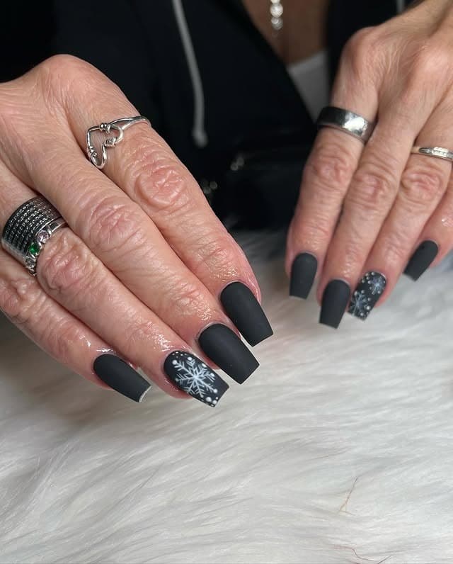 3. Matte Black Snowflake Winter Nails - black nail ideas