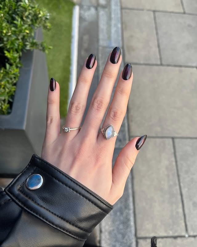 6. Deep Black Chrome Almond Nails - black nail ideas
