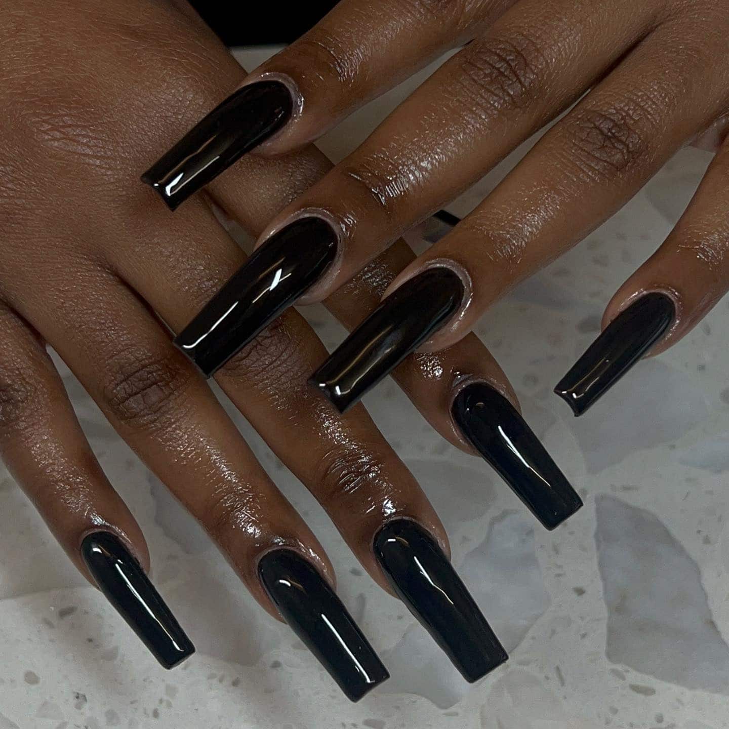 11. Glossy Black Coffin Nails - black nail ideas