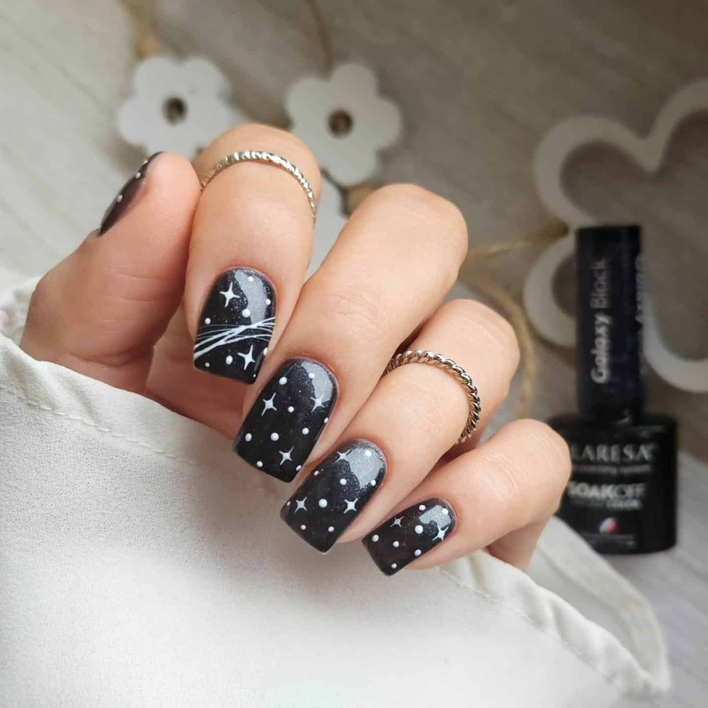 17. Black Galaxy Square Nails with Star Detailing - black nail ideas