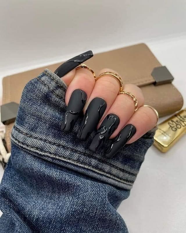 22. Glossy Black Drip Coffin Nails - black nail ideas
