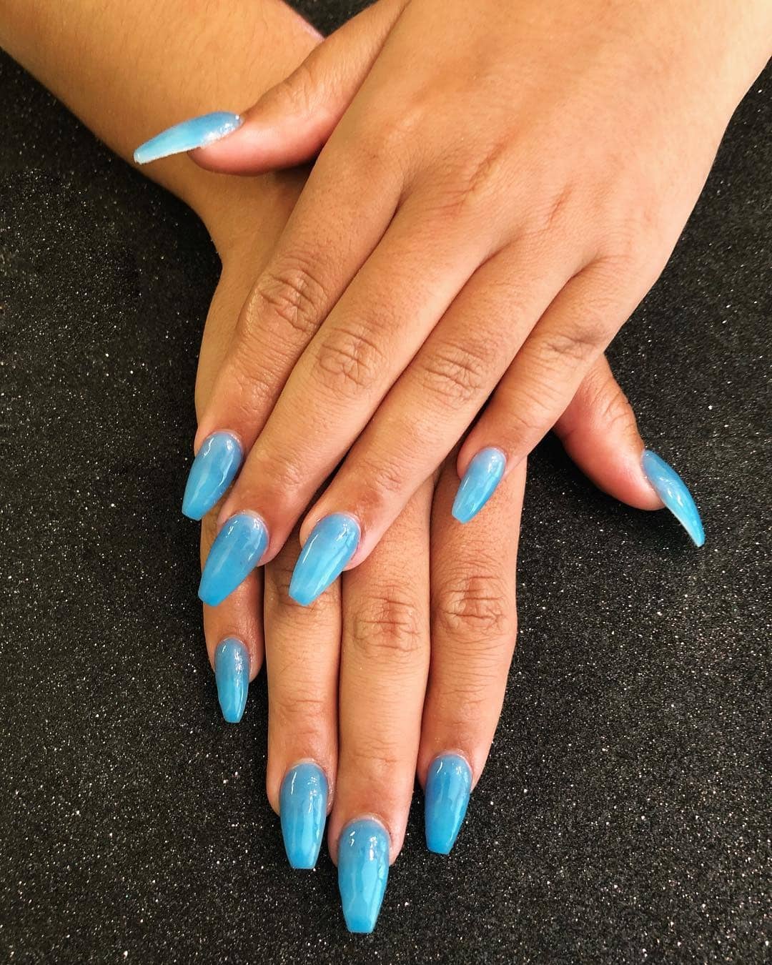 13. Sky Blue Coffin Nails High Shine - dark coffin nail ideas