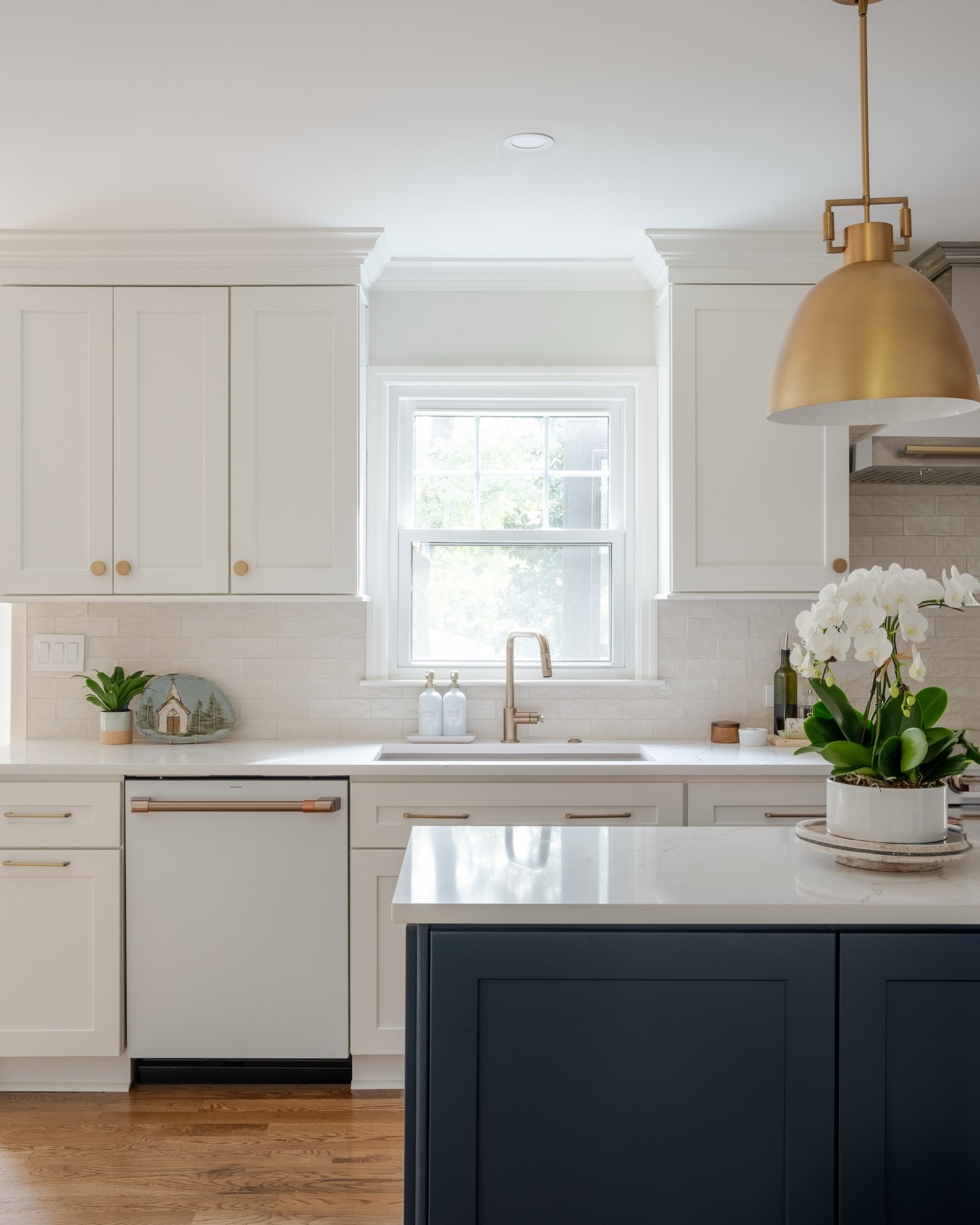 3. Soft Neutral Kitchen with White Countertops and Brass Details - white countertop kitchen ideas