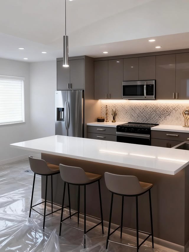 7. Modern Taupe Kitchen with Seamless White Countertops - white countertop kitchen ideas