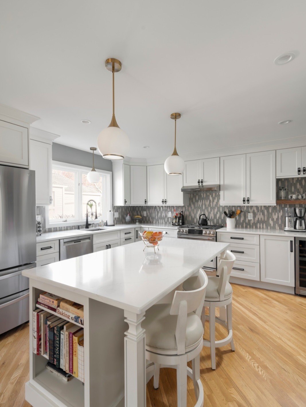 9. Transitional White Kitchen with Decorative Backsplash - white countertop kitchen ideas