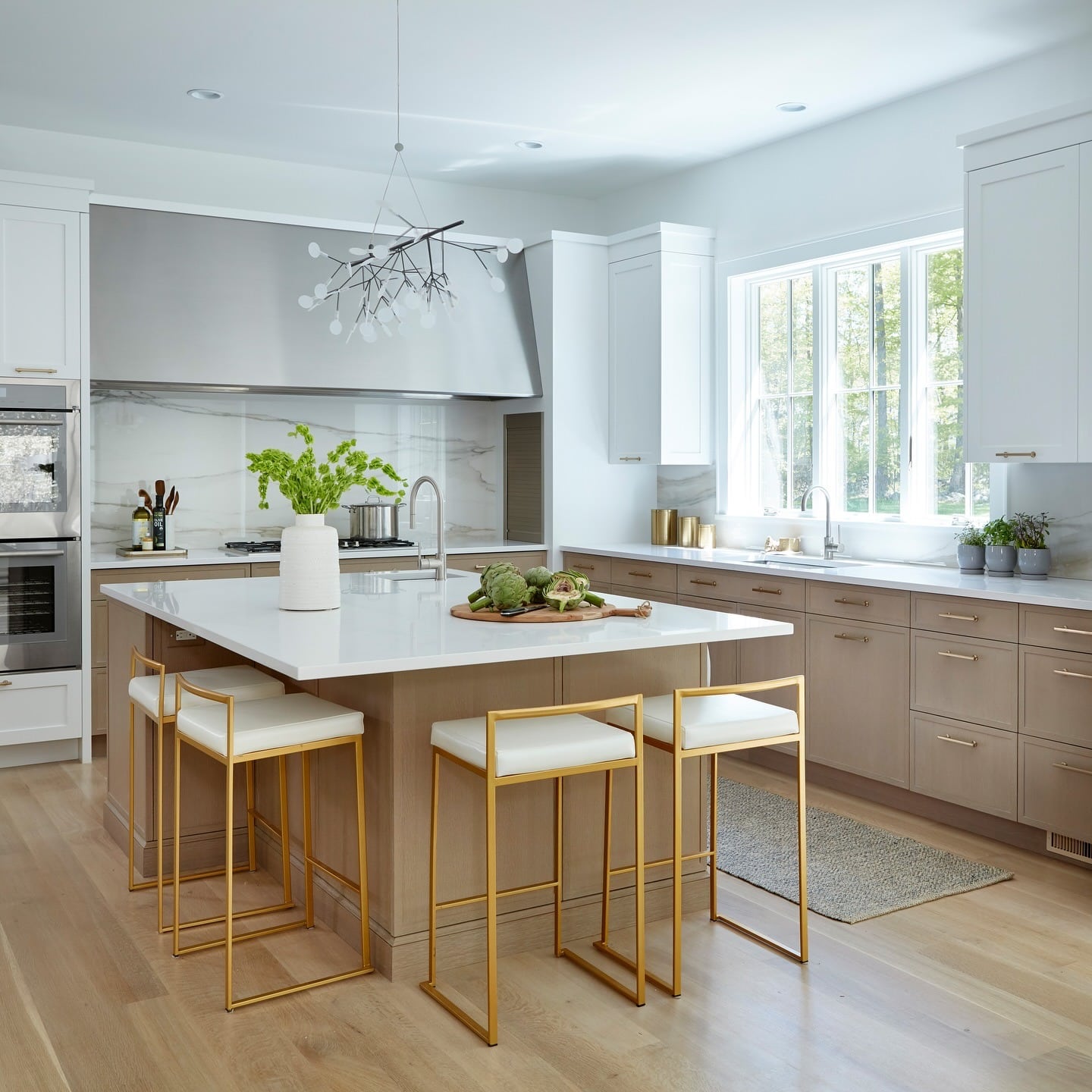 14. Bright White Countertop Kitchen with Warm Taupe Cabinetry - white countertop kitchen ideas