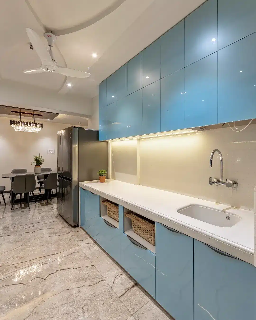 19. Contemporary Blue Cabinet Kitchen with Seamless White Countertops - white countertop kitchen ideas