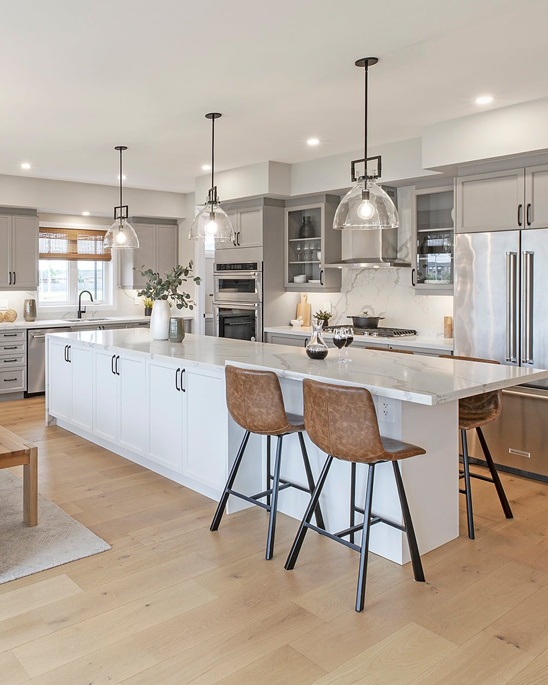 21. Light Gray and White Countertop Kitchen with Warm Leather Accents - white countertop kitchen ideas