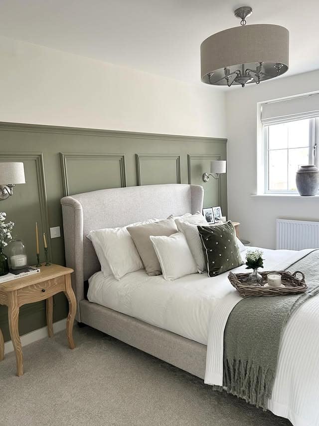 4. Olive Green Paneling with Neutral Upholstered Bed - white wall bedroom ideas