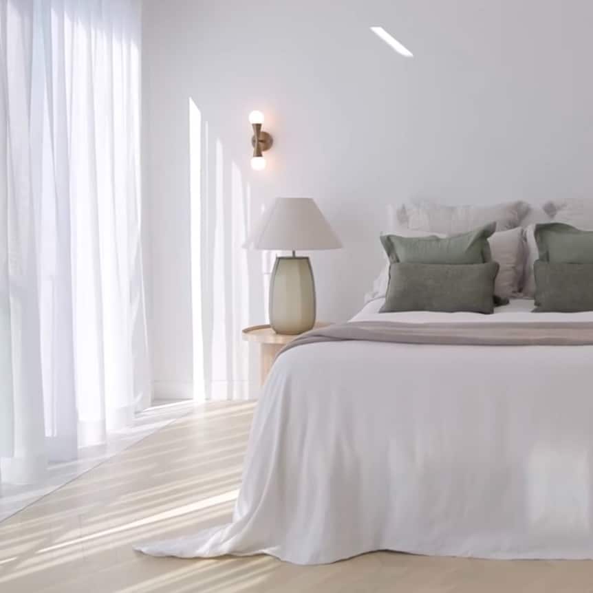 14. Soft White Bedroom with Sheer Curtains and Green Accents - white wall bedroom ideas