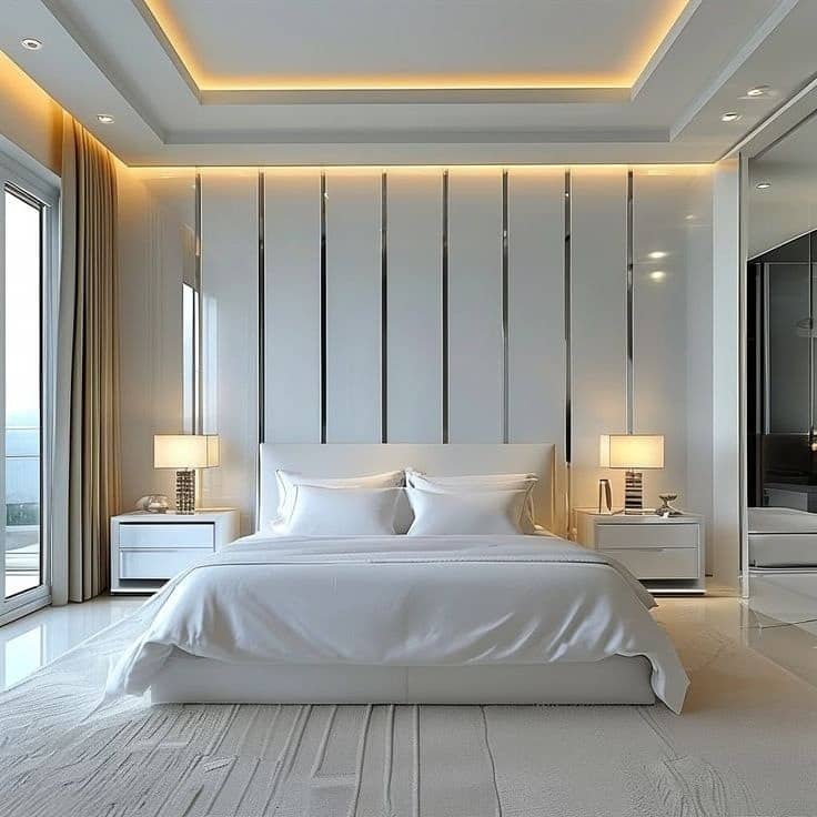 17. Modern White Bedroom with Vertical Panel Feature and Warm Lighting - white wall bedroom ideas