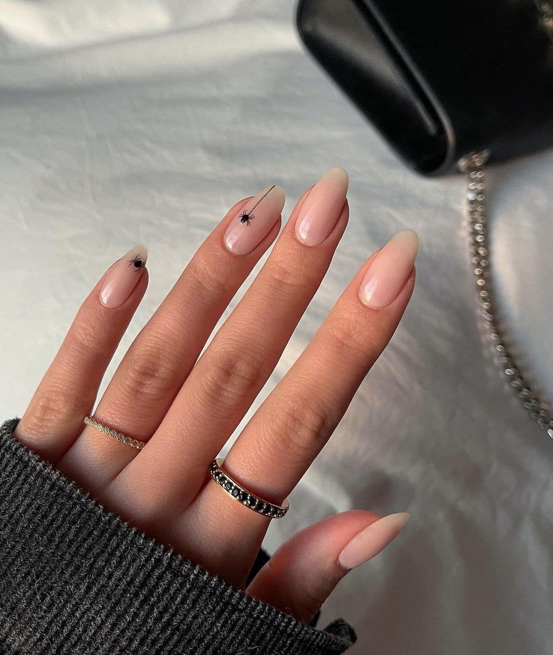 1. Nude Almond Nails with Micro Spider Art - minimalistic nail ideas