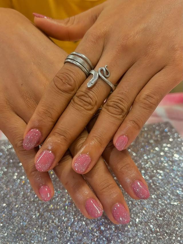 2. Soft Pink Glitter Short Nails - minimalistic nail ideas