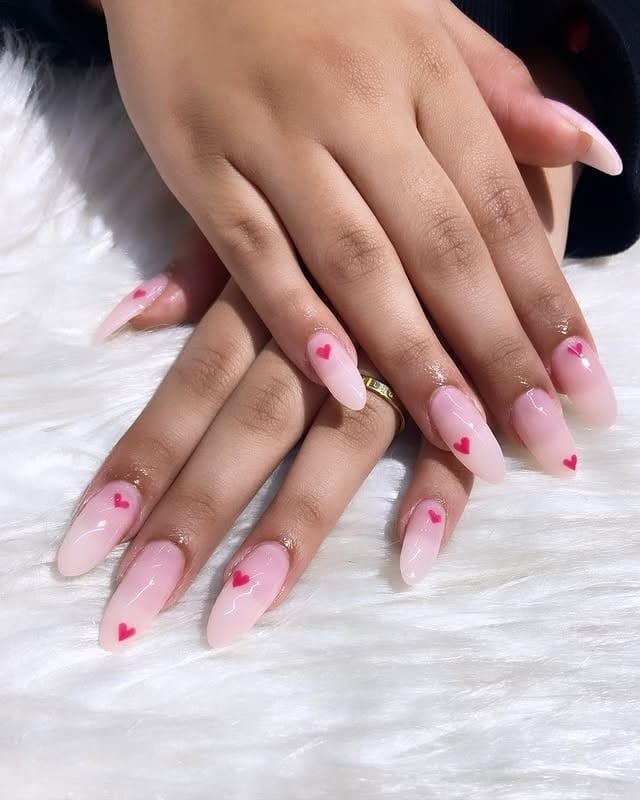12. Milky Pink Almond Nails with Mini Heart Accents - minimalistic nail ideas