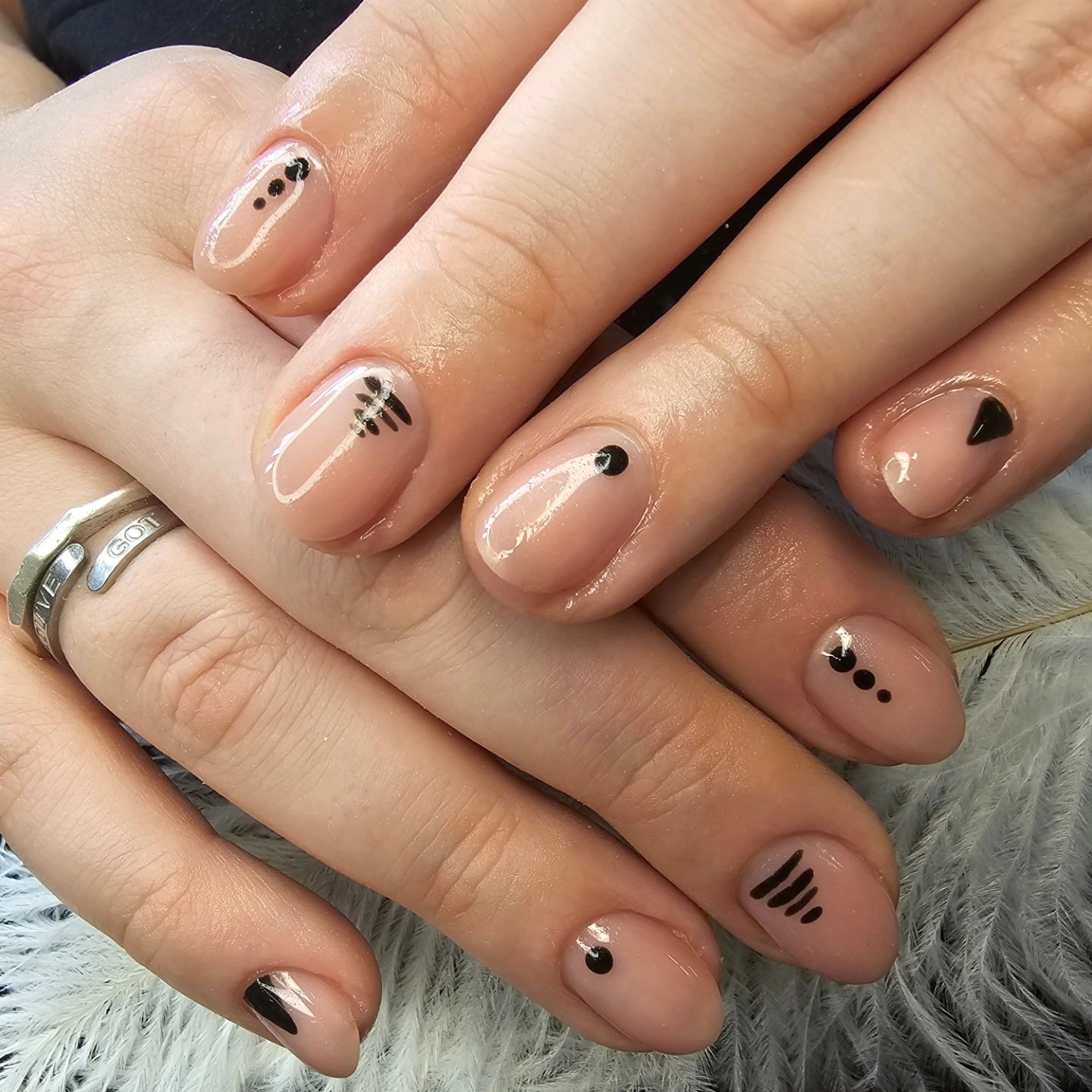 15. Glossy Nude Short Nails with Abstract Black Detailing - minimalistic nail ideas