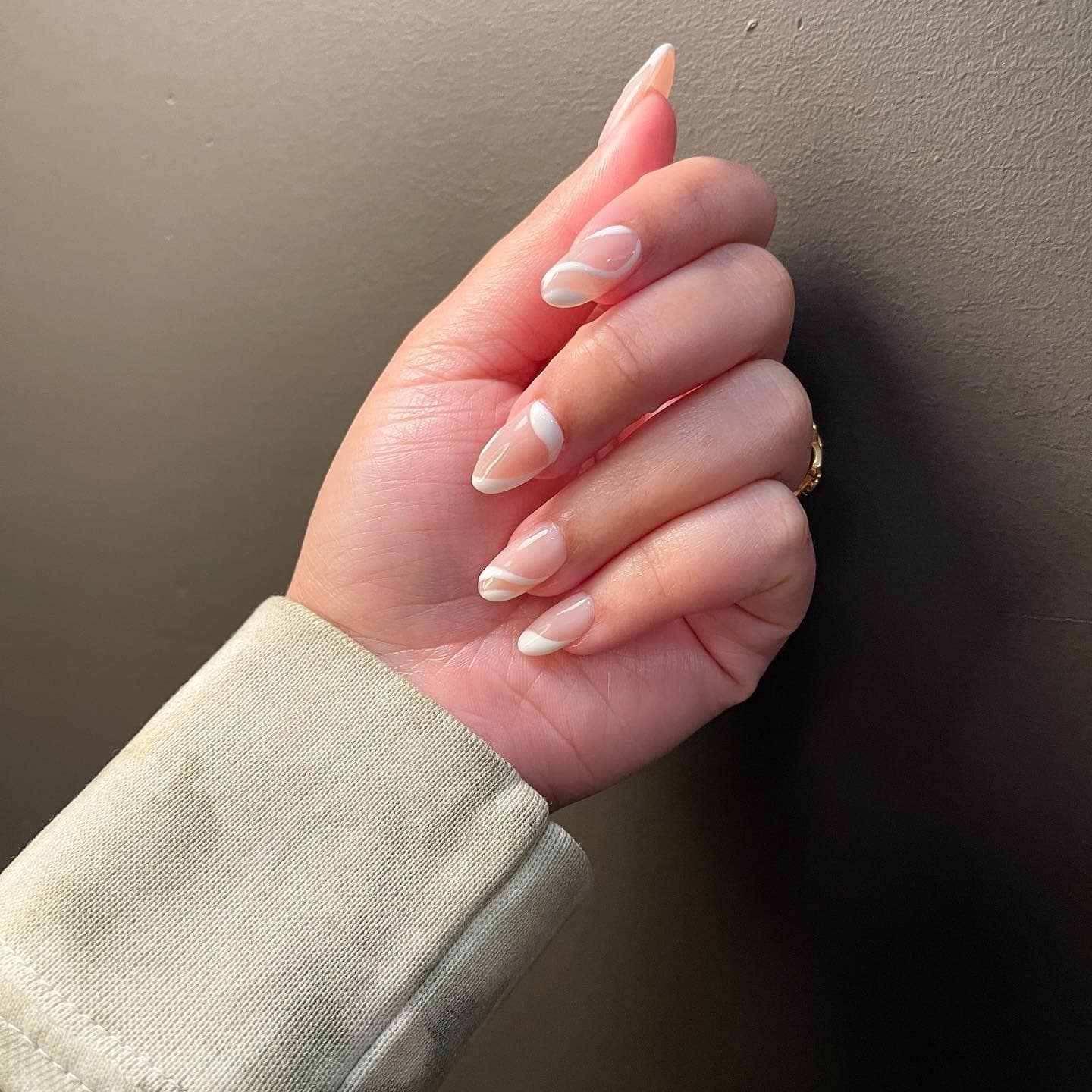 22. Milky Nude Almond Nails with Soft White Swirl Tips - minimalistic nail ideas