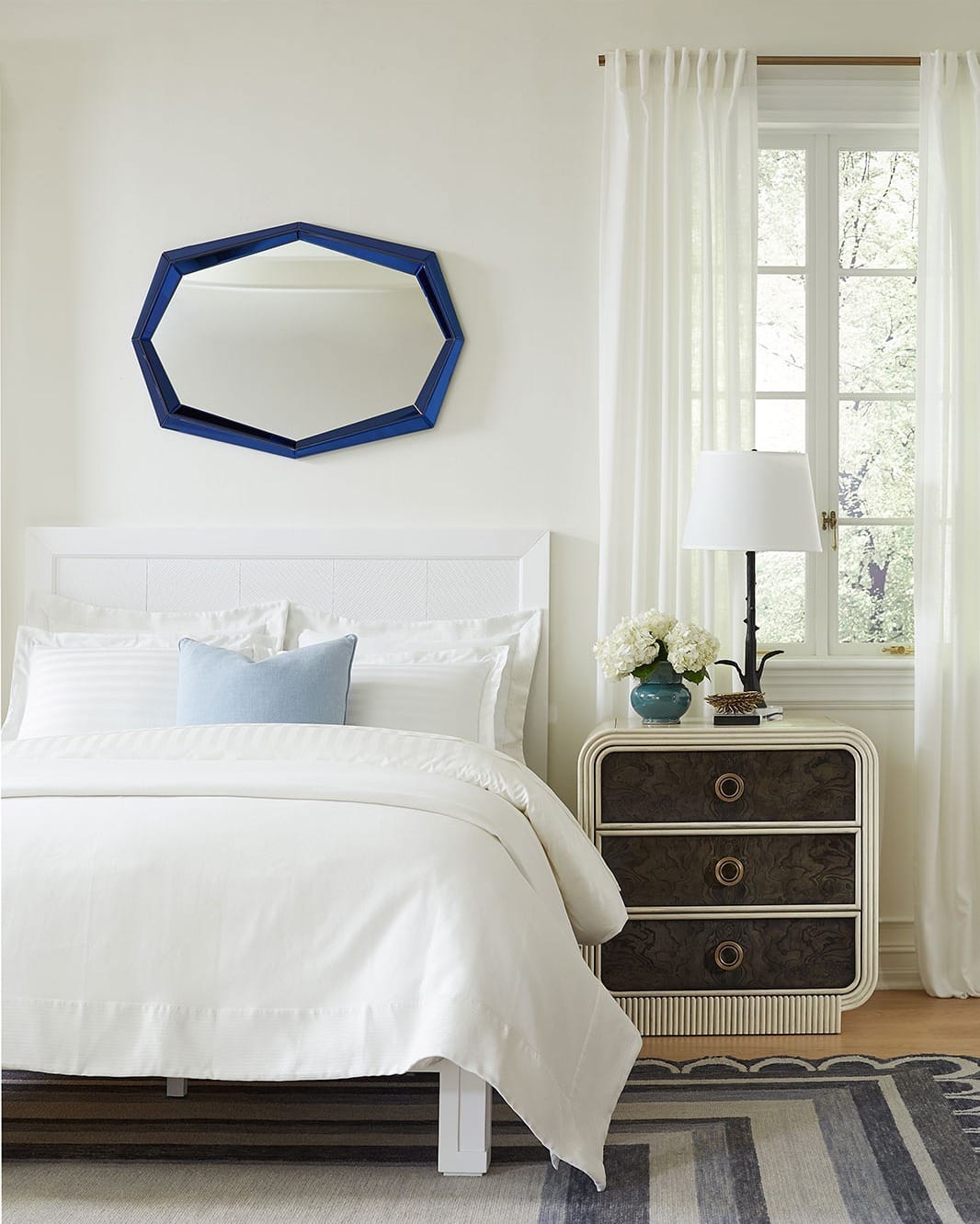 21. Coastal White Bedroom with Blue Geometric Mirror Accent - bedroom ideas with mirror
